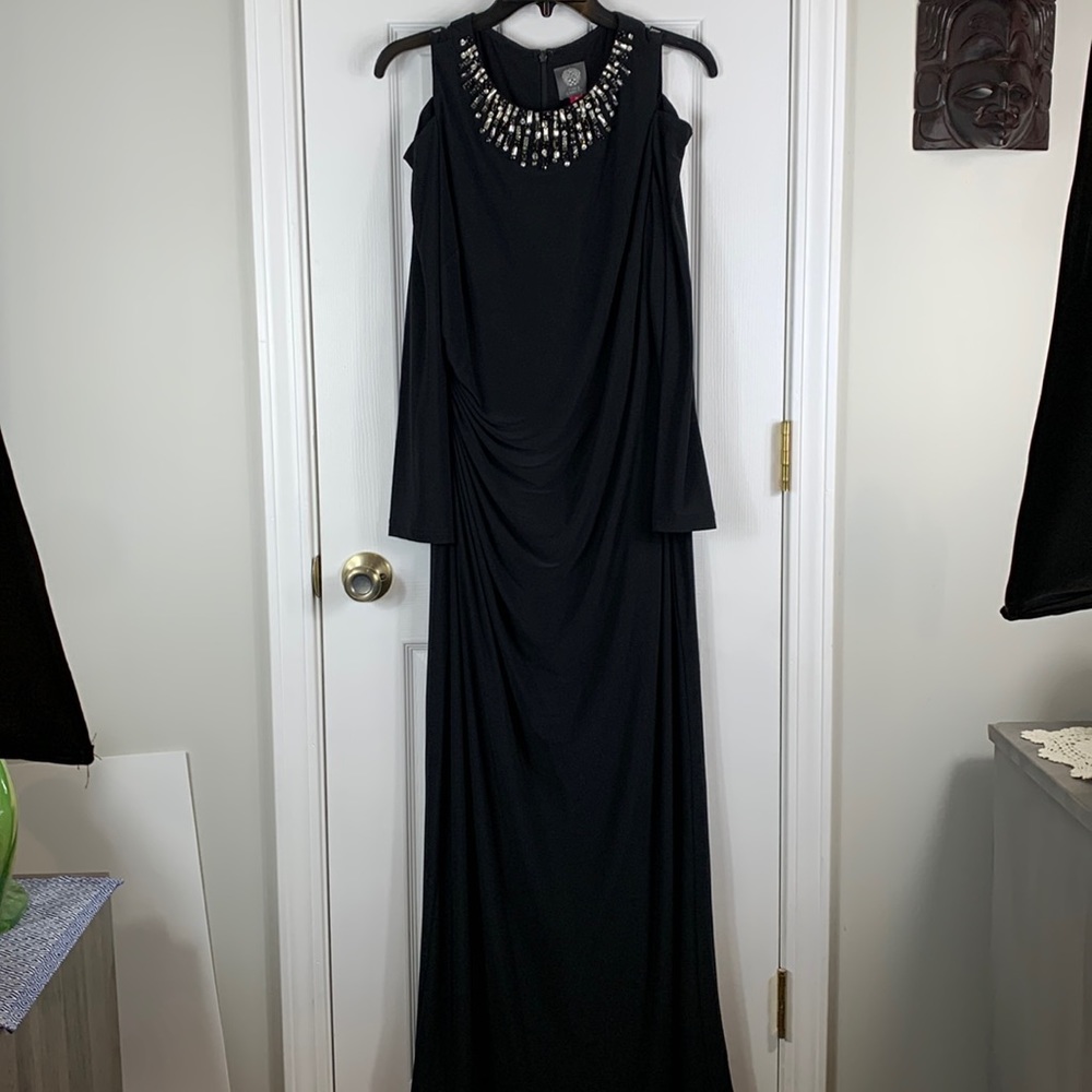 Vince Camaro black evening gown size 14. Has long sleeves with cold shoulders